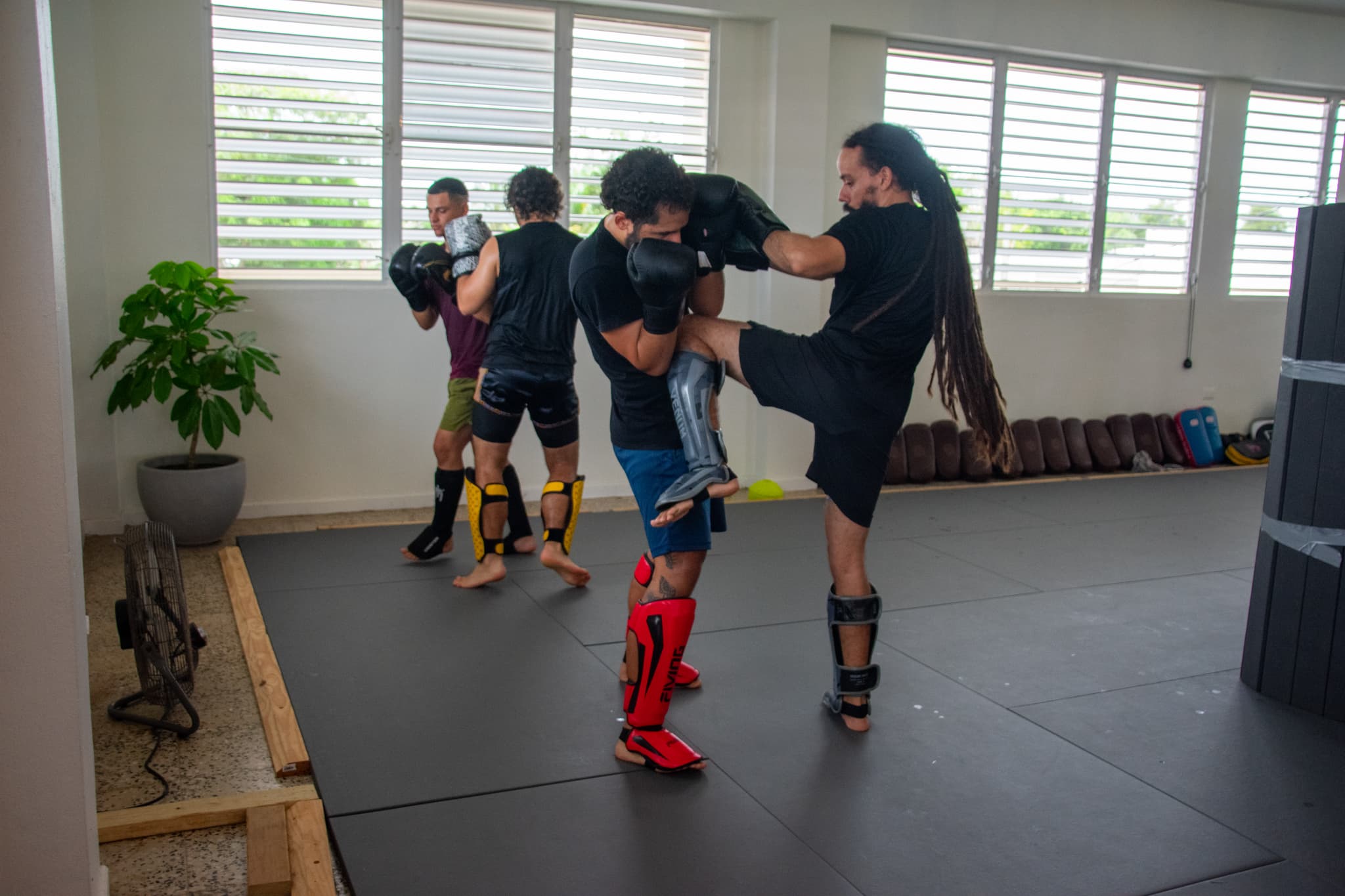 Students practicing Muay Thai techniques